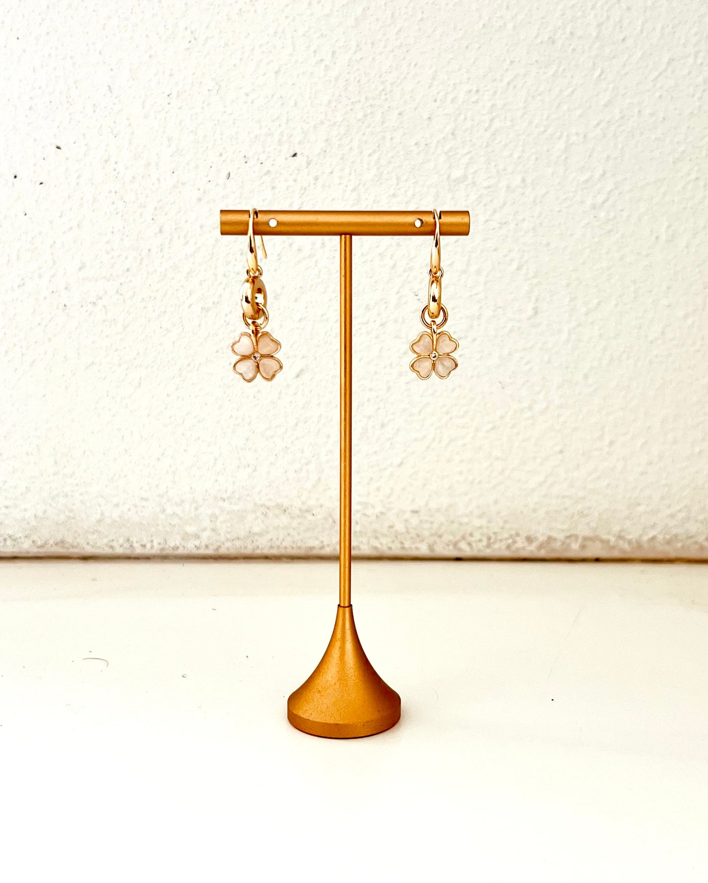 Gold ring and flower earrings