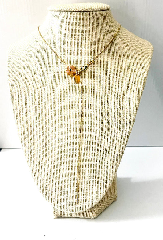 Pink resin flower and golden cube charm on a fine gold-plated ball chain necklace – view 2