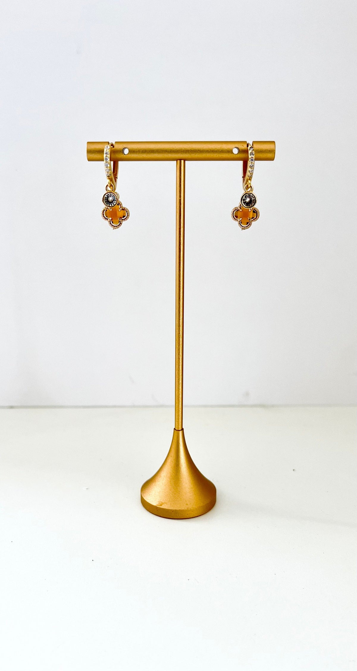 Double huggie earrings with cubic zirconia sparkle and warm amber clover charms – view 2
