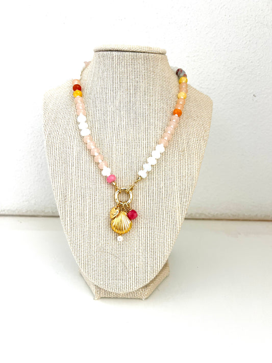 Pink toned gemstone necklace with shell