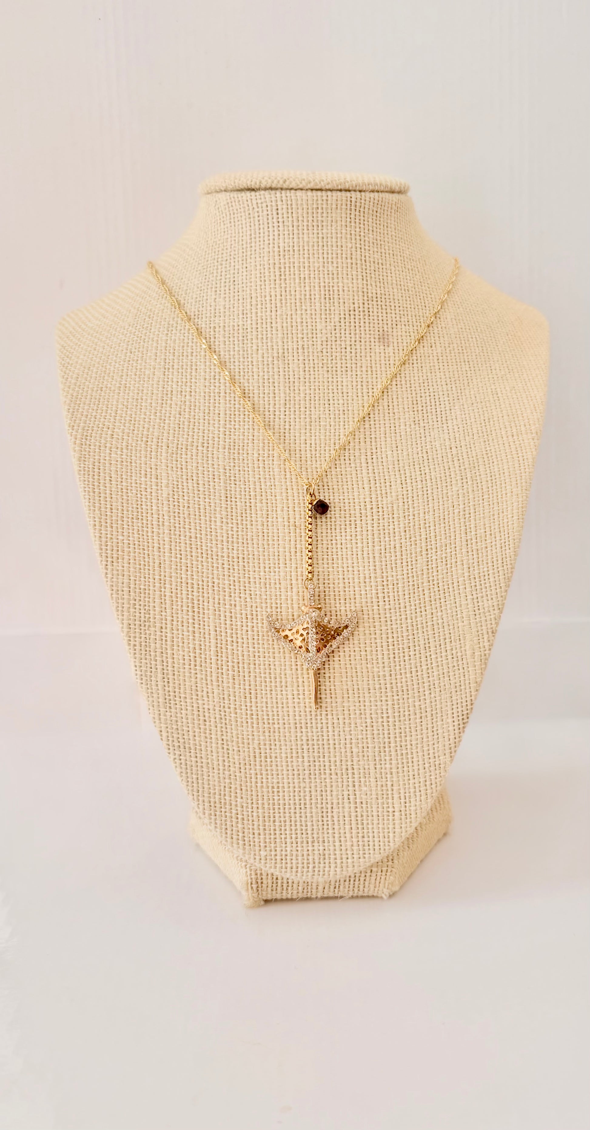 Gold filled box chain necklace with a manta ray feature
