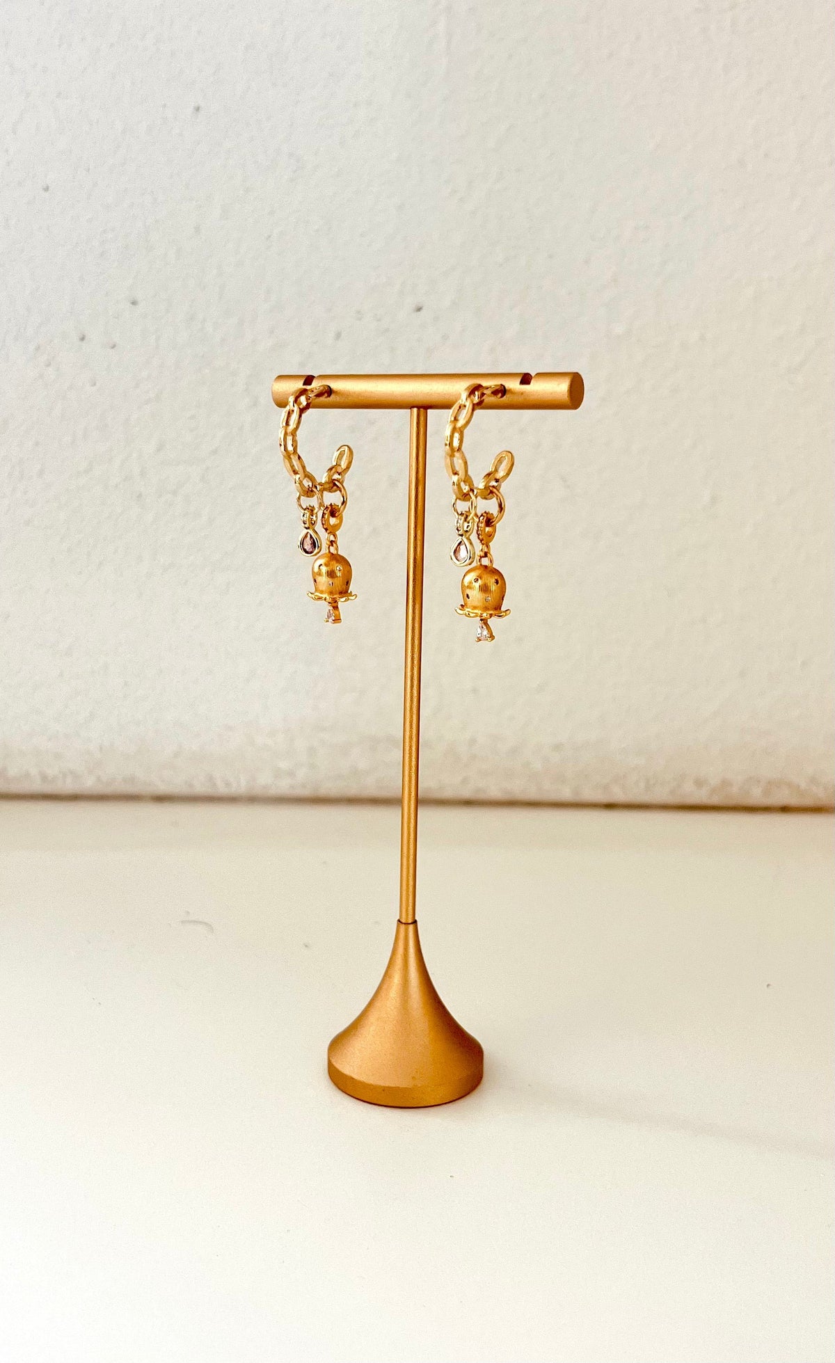 Chain-style hoop earrings with 24K gold-filled flower buds and cubic zirconia accents