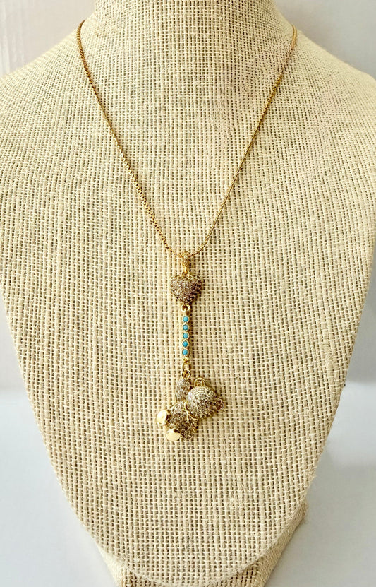 18K gold plated snake chain necklace with a micro pave cubic zirconia heart, teddy and turquoise connector