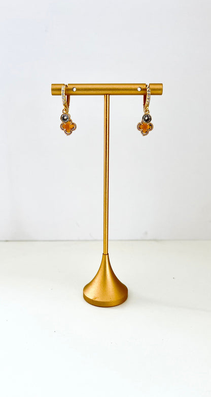 Double huggie earrings with cubic zirconia sparkle and warm amber clover charms – view 2